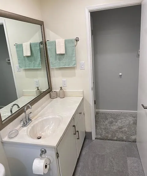 Spacious vanity and full wall mirror