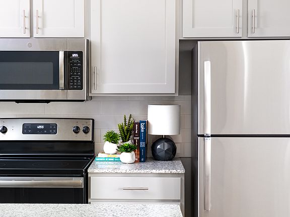 Kitchens with premium granite countertops and stainless steel appliances