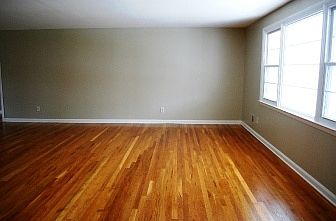 Large living room freshly painted in neutral tones