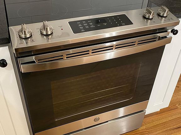 Brand new smooth top stainless steel range.