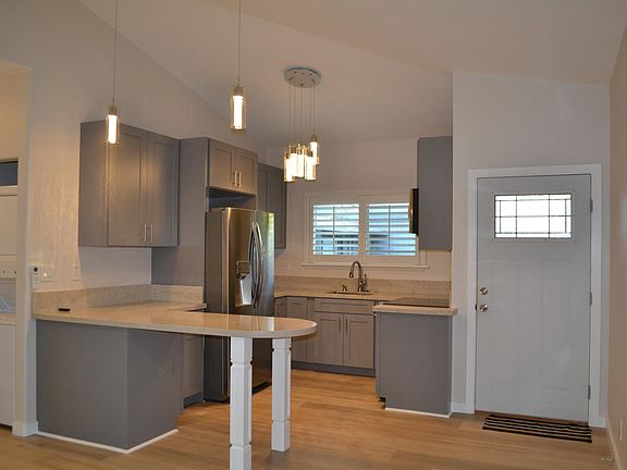 Modern kitchen with counter top overhang for additional seating. Sink Garbage disposal, Microwave, Electric Stove/Oven, Full size refrigerator/freezer icemaker/water dispenser. Full size washer and dryer included.