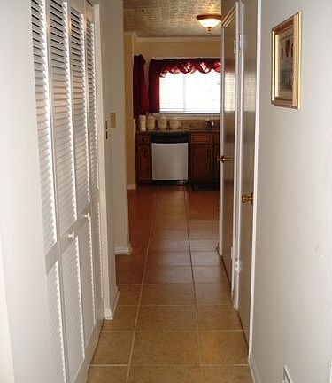Kitchen view 4 with Hall and Laundry room and pantry