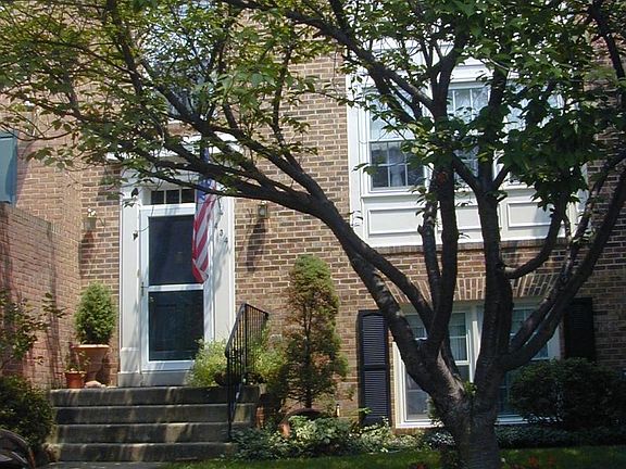 Front of townhouse, with two reserved parking spaces. There are 10 guest parking spaces in front.