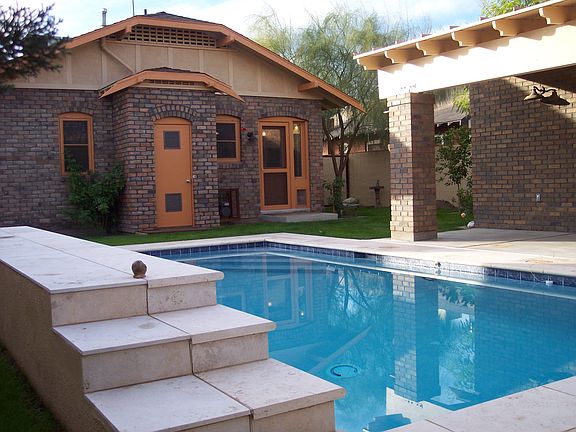 View of back of home, custom, 1-yr. old pool 