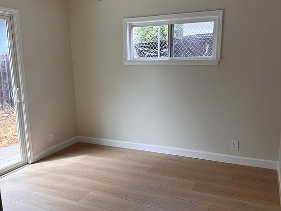 One of 2 rooms downstairs with the garden view