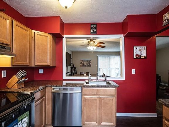 Pass through window above sink gives a great open spaced feel to the kitchen.