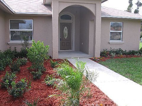 Front view with upgraded landscaping