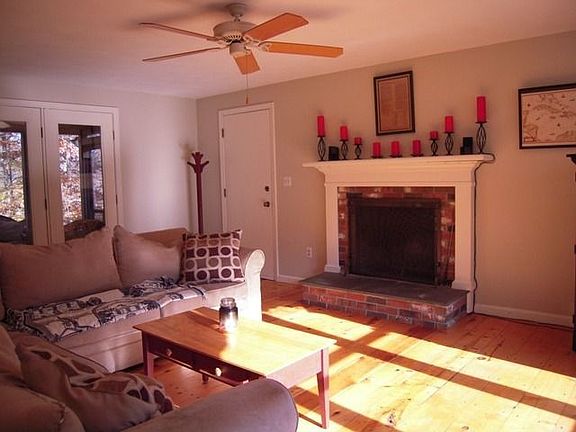 Family room, Fireplace, wide pine floors.
