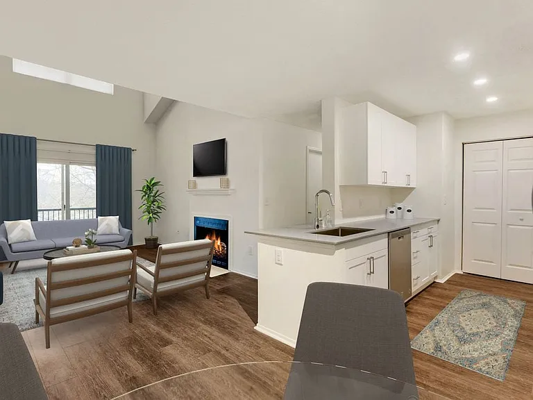 Renovated Package I kitchen, dining, and living areas with hard surface plank flooring