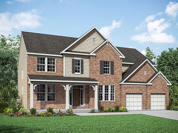 new home with brick and shakes