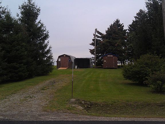 2 storage sheds & Car Port.