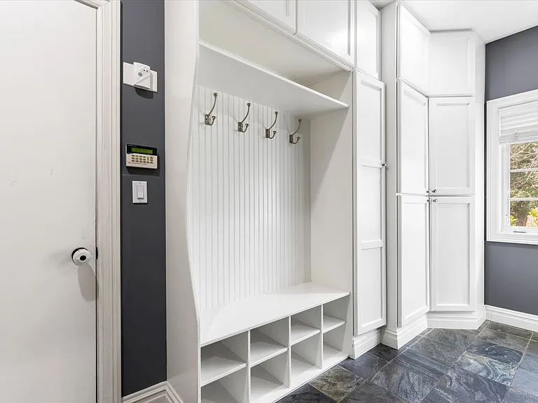 Mudroom next to 2 car garage, additional refrigerator and storage