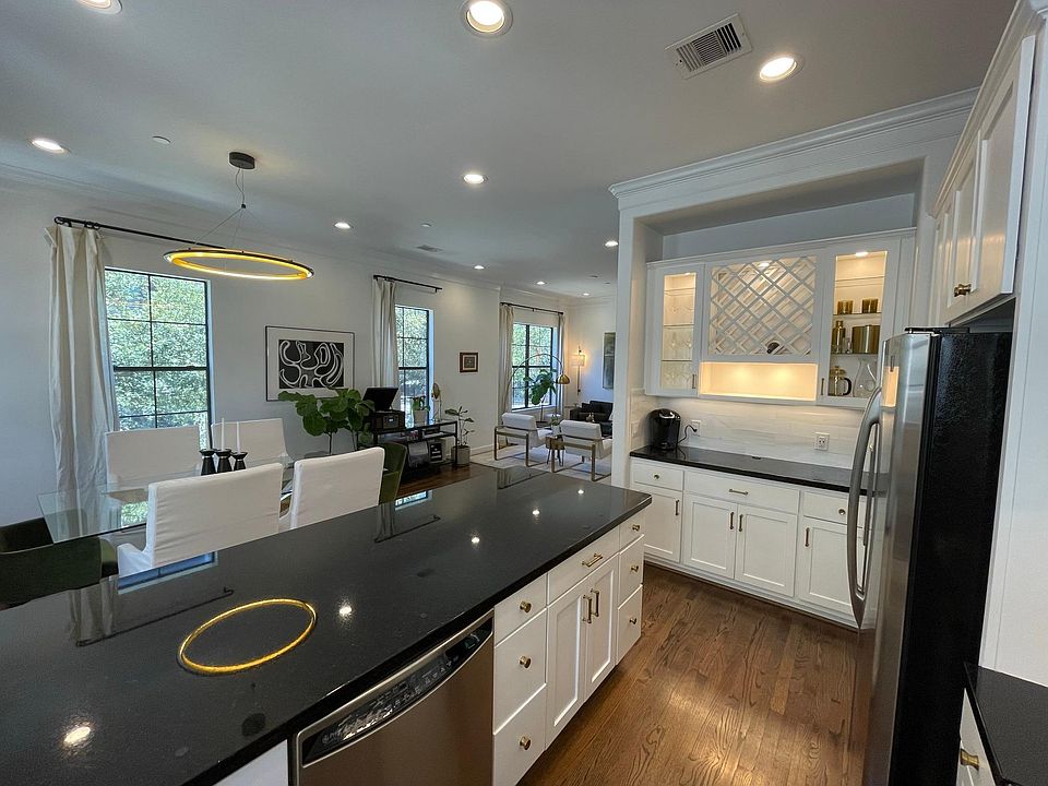 Custom wine rack, dry bar, and storage for entertaining! Hosting from the kitchen has an open view to the whole floor.