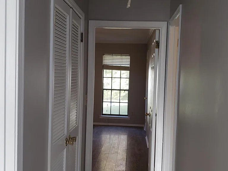 View from Hallway into Master Bedroom; Linen Closet