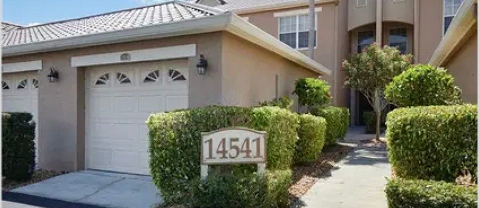 Detached parking garage with. private court yard entry to condo.