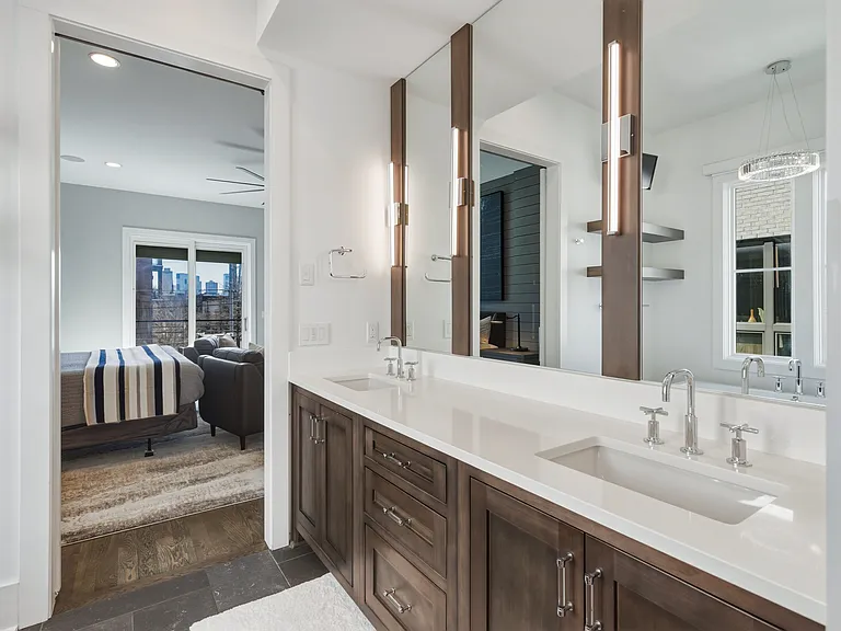 Bathroom #1 is attached to the master bedroom with a dual vanity and stand alone shower + tub. Plus a huge California closet with custom built-ins.
