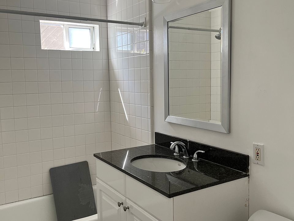 Renovated Bathroom with Designer Tile, New Vanity, Desugner Mirror & Modern Lighting