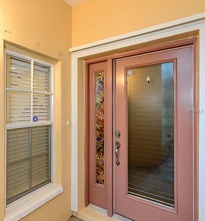Covered Private Entry into the Home. Beautiful Sidelight is Stained Glass!