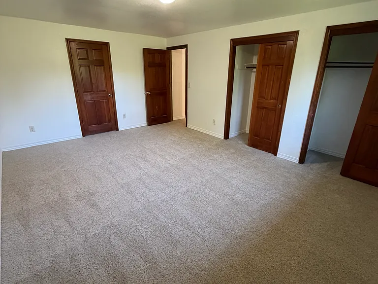Large 3rd floor bedroom 1 w/ large closets and door to 3rd floor shared bath