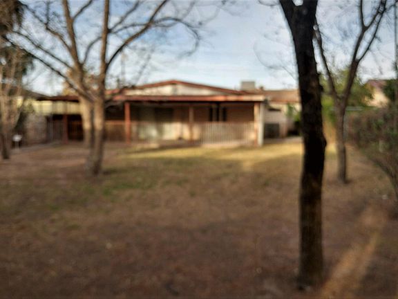 Pecan and fruit trees, including grapes and pistachios. Yard is watered with canal water through water rights. 13 watering days are included normally each year. Paid by owner.