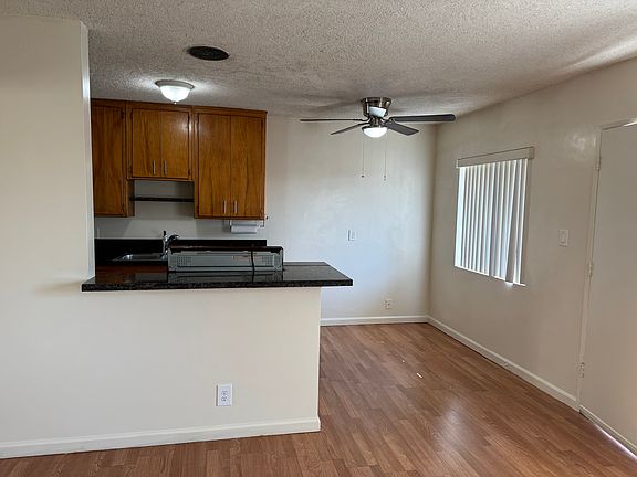 View from living room of eating area and portion of kitchen.