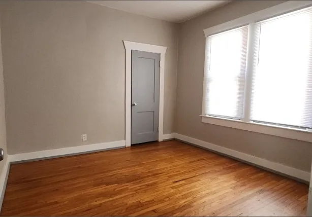 This is one of 2 bedrooms located on either side of the bathroom, off of the dining room.