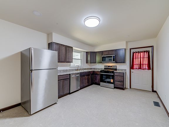Updated kitchen with all new stainless steel appliances. Actually waiting for a newer/bigger fridge and will send this one to the basement.