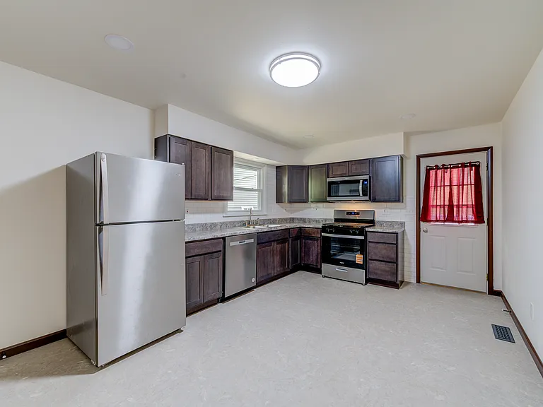 Updated kitchen with all new stainless steel appliances. Actually waiting for a newer/bigger fridge and will send this one to the basement.
