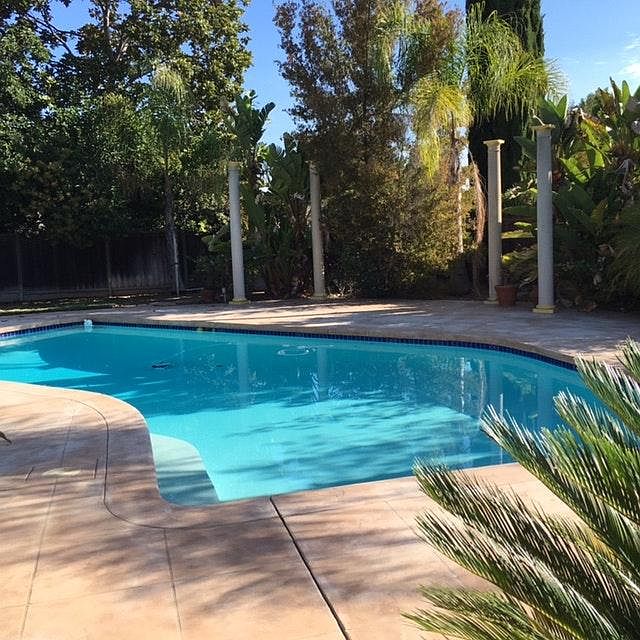 Pool w/ Doric columns, semi tropical plants