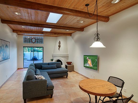 Main Living & Dining area - For demonstration purposes only, TV added digitally. Actual wall-mounted TV to come.