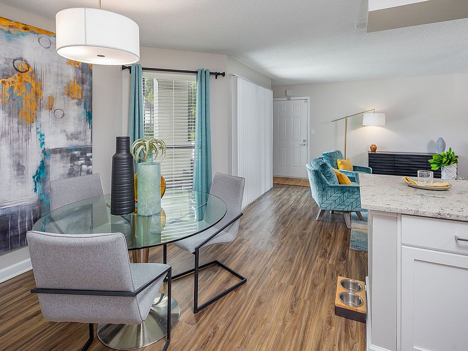 Dining area with hardwood-style flooring & built-in lighting