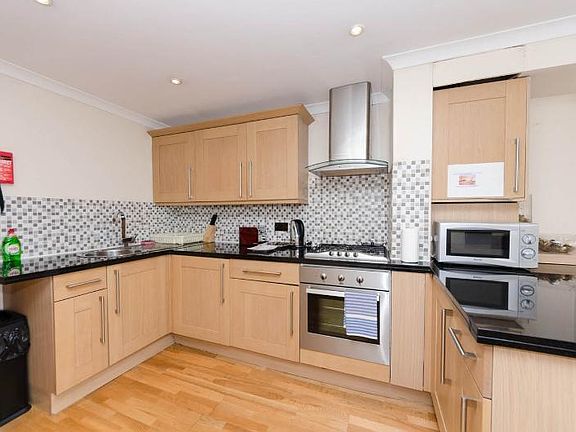5th image of 550 W 22nd St APT 1