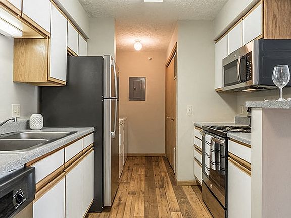 Kitchen with attached washroom.