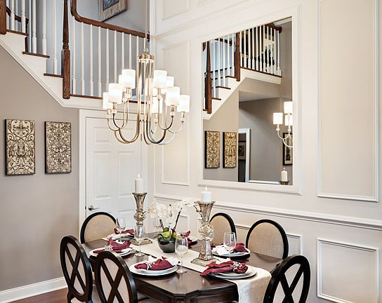 Dining room with two-story ceiling