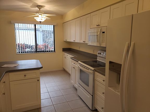 Another shot of the kitchen from the dining room. Lots of cabinets and drawers!