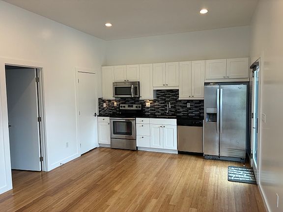 KitKitchen and bedroom entrance to left