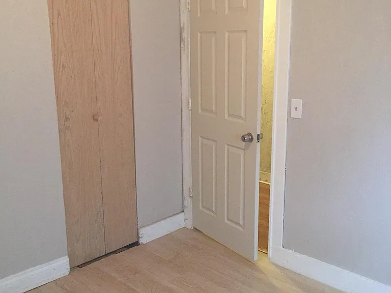 1st bedroom near the entrance with windows to street