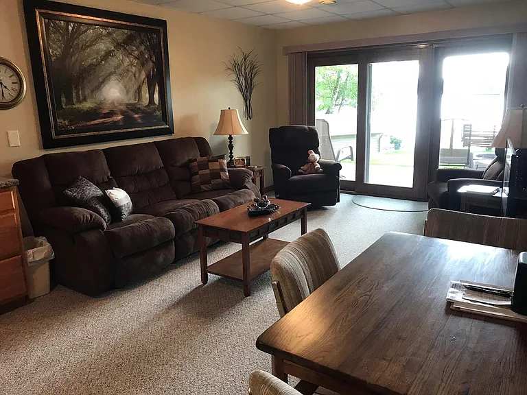 Lower living room with walk out to lake and patio