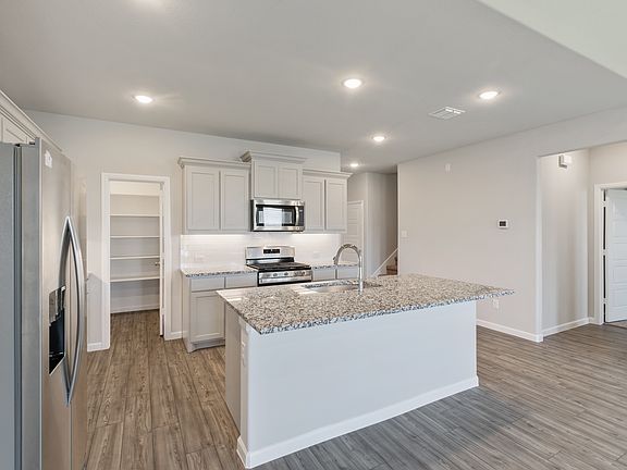 Kitchen in the Masters home plan by Trophy Signature Homes