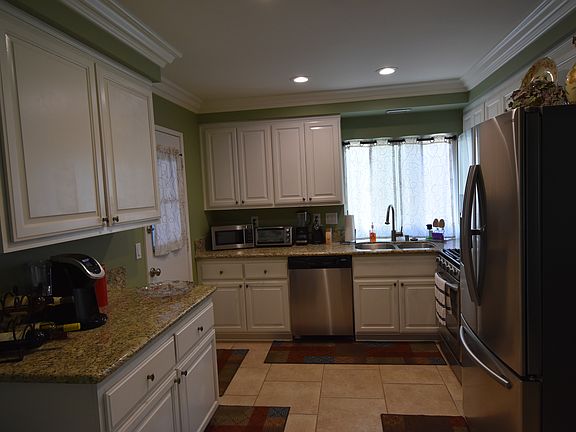 White Cabinets/Tile Flooring