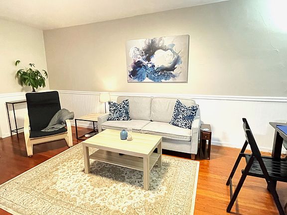 Living area (Staged for concept only - unit rents unfurnished)