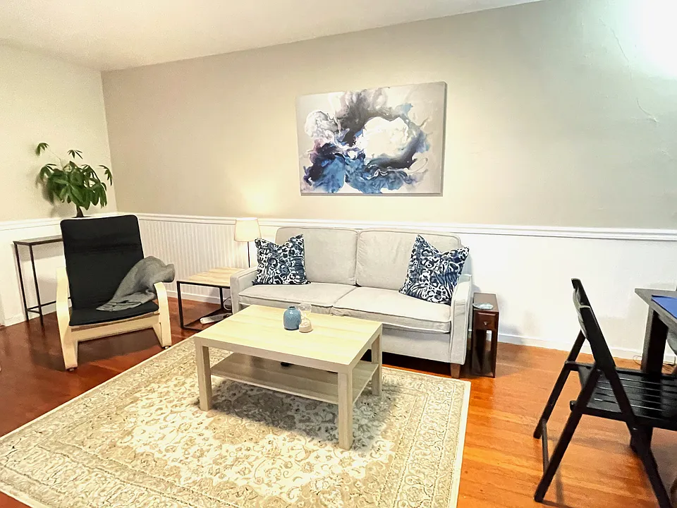 Living area (Staged for concept only - unit rents unfurnished)