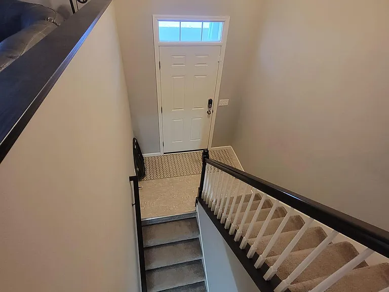 Stairs from living area to basement