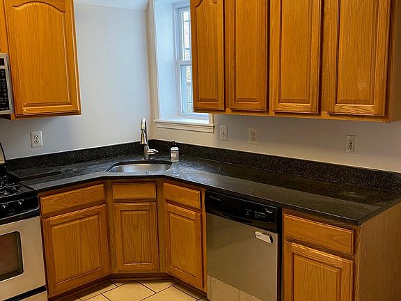 Kitchen with oak cabinets, granite countertops, and stainless steel appliances