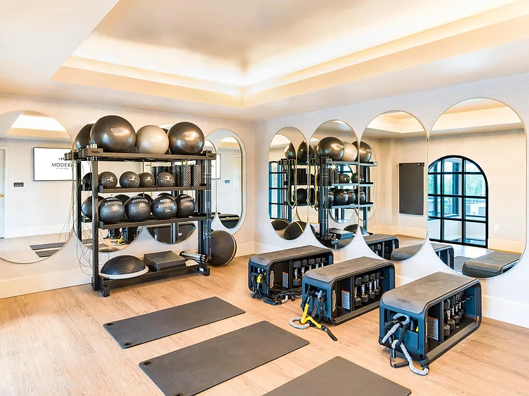 A dedicated Yoga room at Modera University Park, designed for focused training.