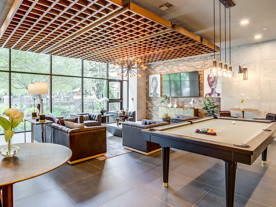 Resident clubhouse with coworking and social spaces at Hermann Park Lofts.