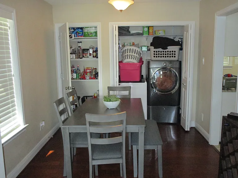 Dining room with pantry and W/D units.