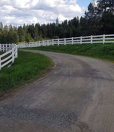 Vinyl fencing along the driv
