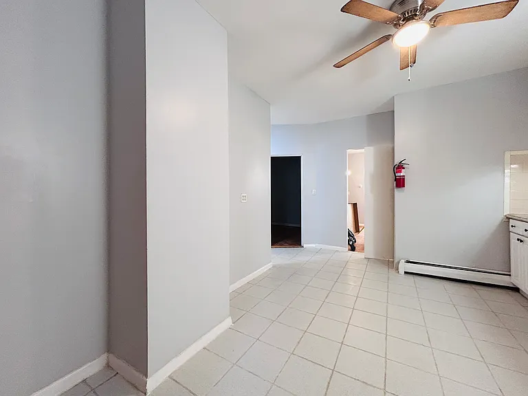 Kitchen left wall, plenty of space for fridge and dining table