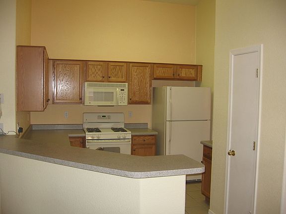Kitchen with maple cabinets and pantry.